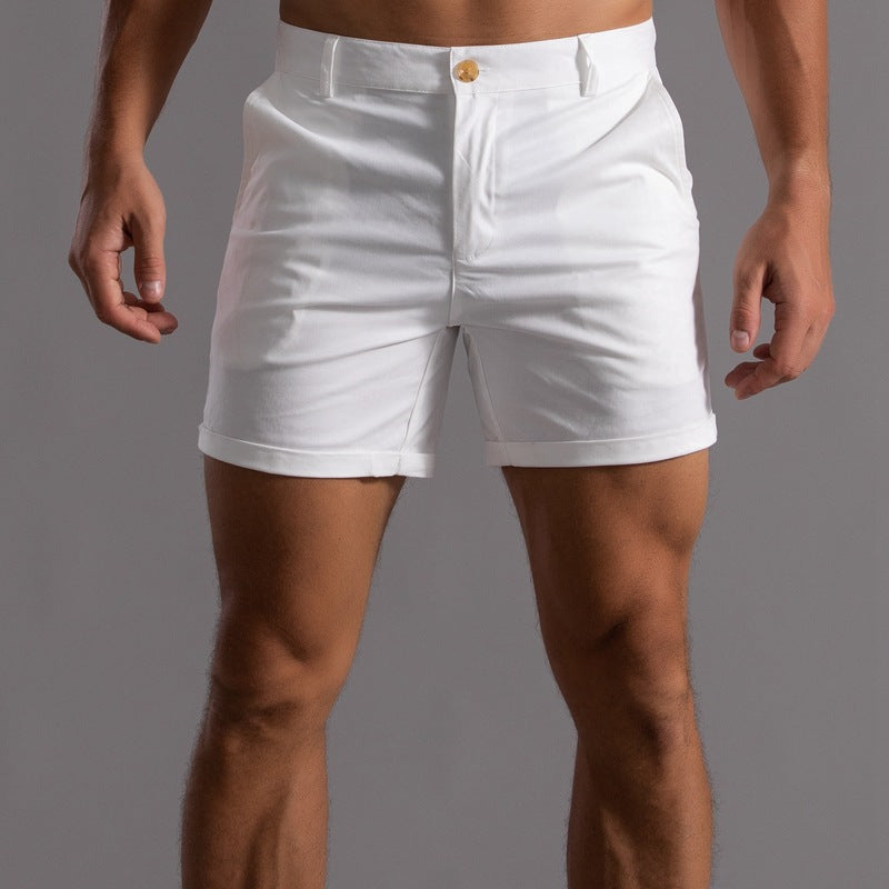 White shorts worn by a person on a gray background