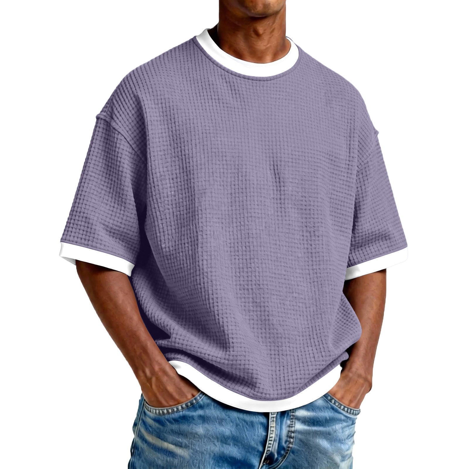 Person wearing a purple textured t-shirt with white trim on a white background