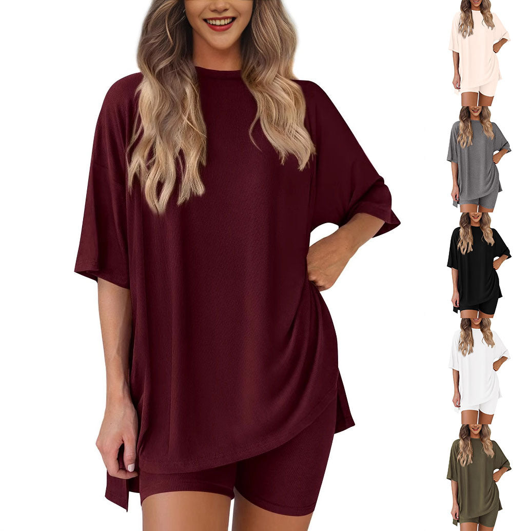 Woman wearing a burgundy dress with multiple color options displayed below.