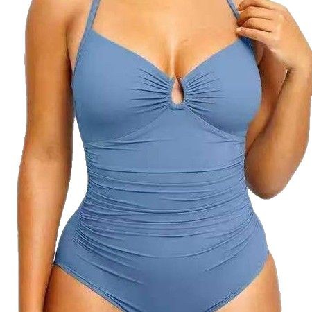 Blue swimsuit with a unique cutout design on a plain background