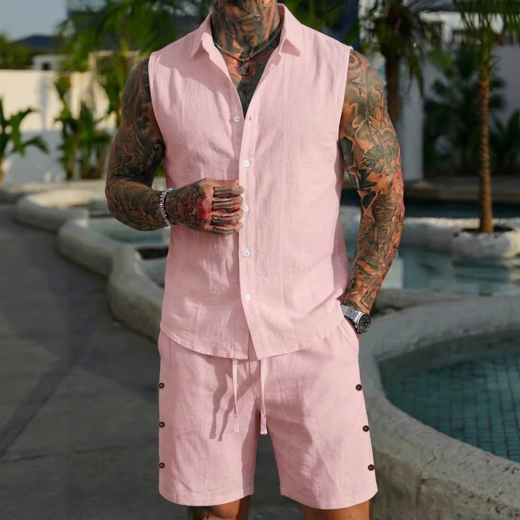 Person wearing a pink outfit with tattoos standing by a pool.