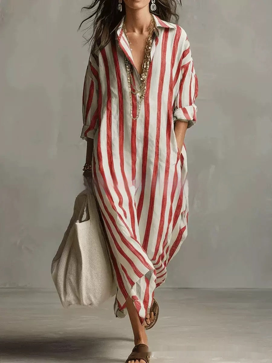 Woman wearing a red and white striped dress with a plain background