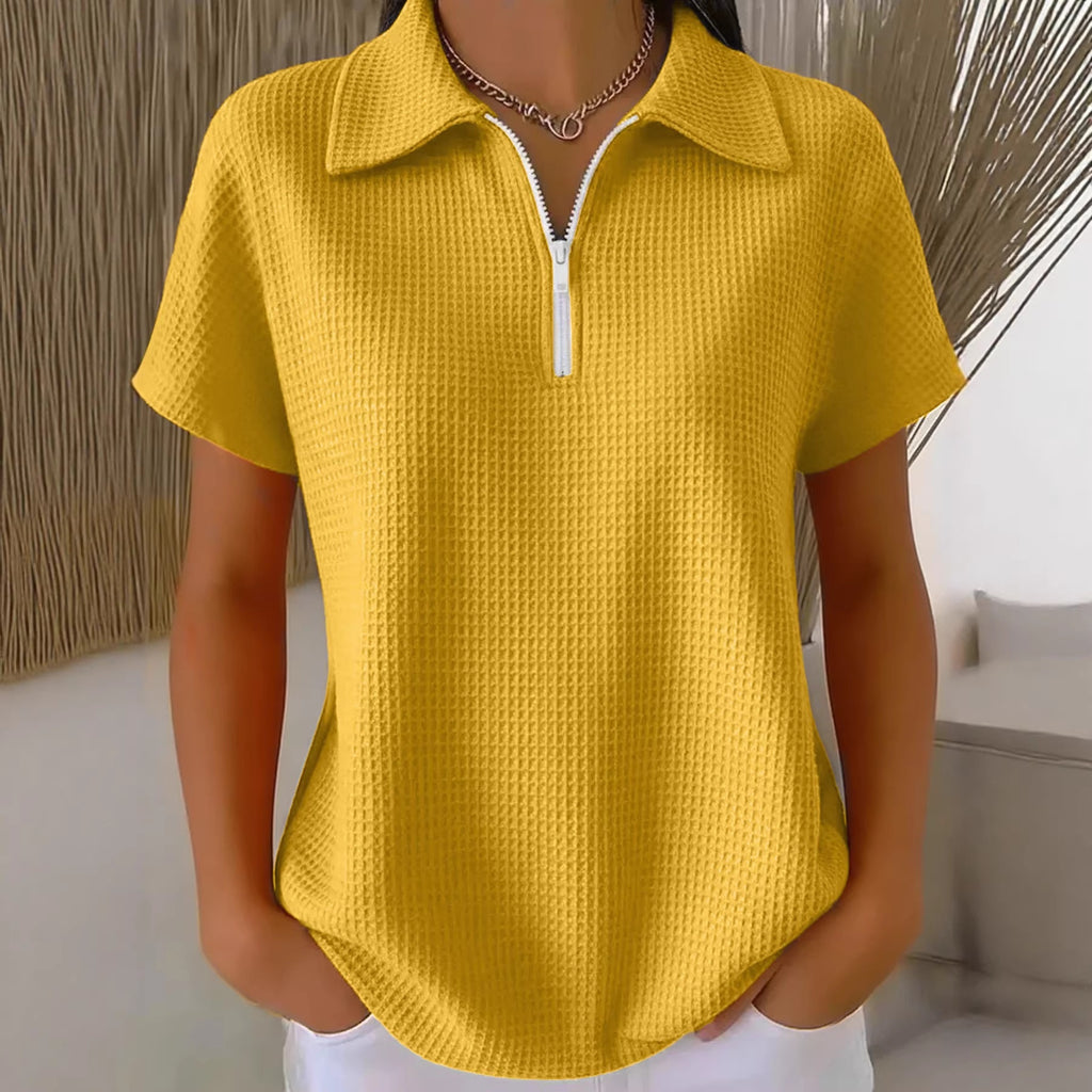 Yellow textured short-sleeve shirt worn by a mannequin against a neutral background