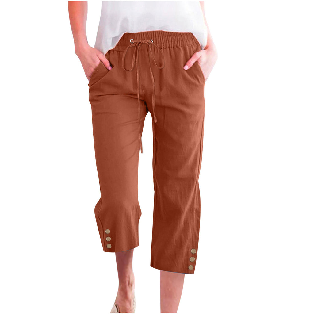 Brown pants with button details on a white background