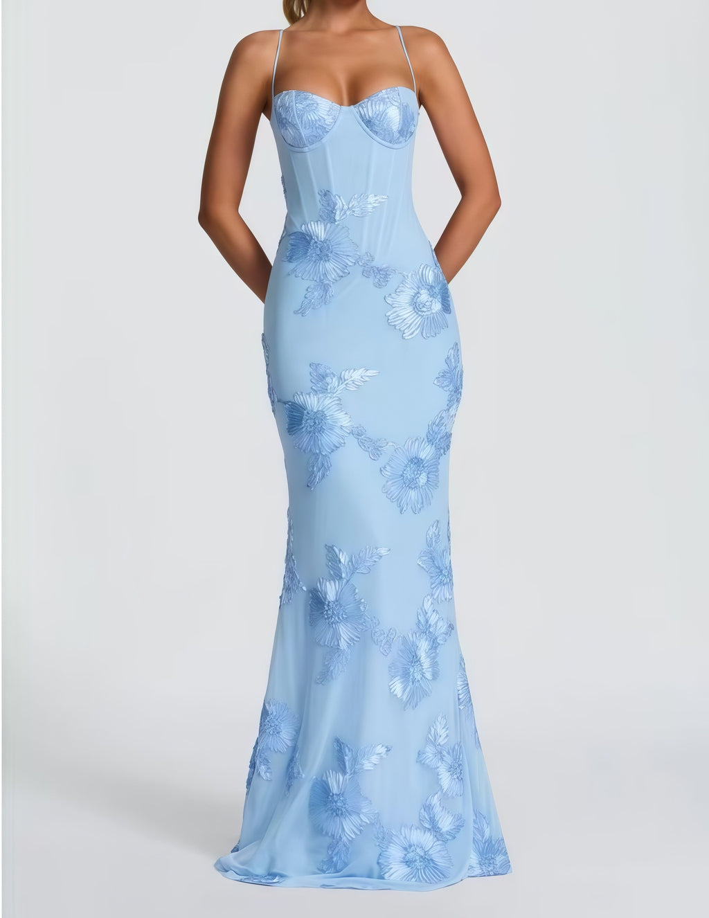 Light blue evening gown with floral pattern on a white background