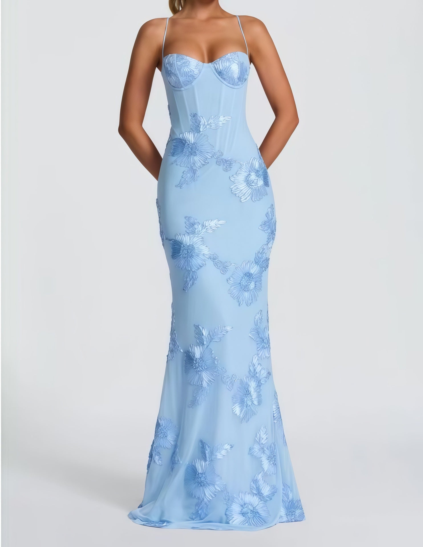 Light blue evening gown with floral pattern on a white background