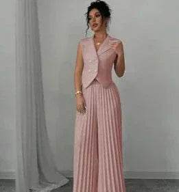 Woman wearing pink pleated wide-leg pants and matching vest, stylish ZA-Zola fashion.