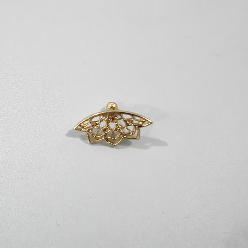 Gold filigree pendant on a light gray background