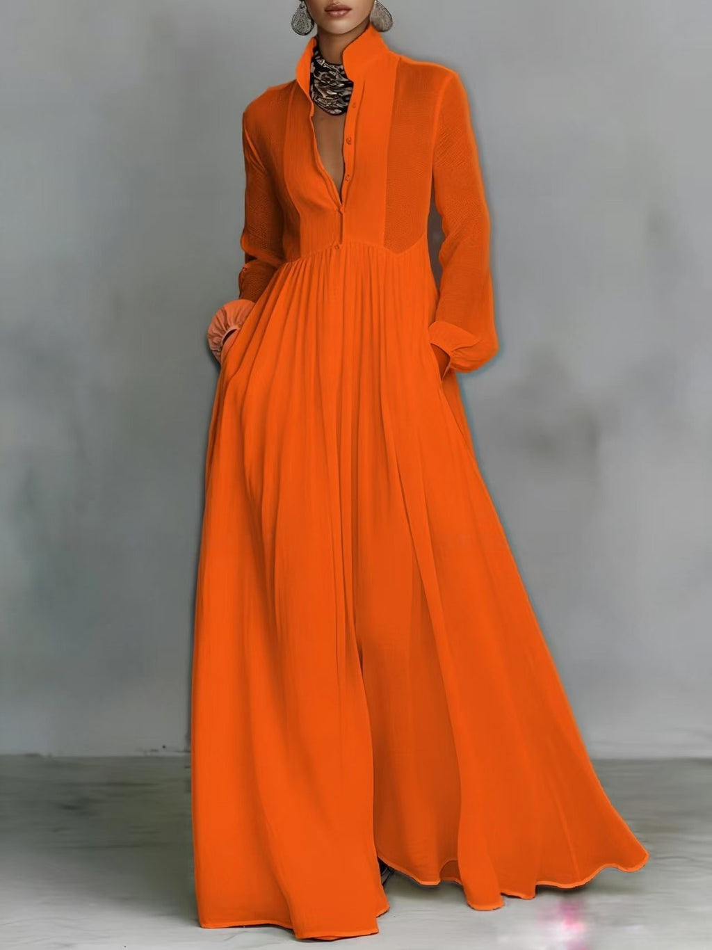 Orange long-sleeve dress on a plain background