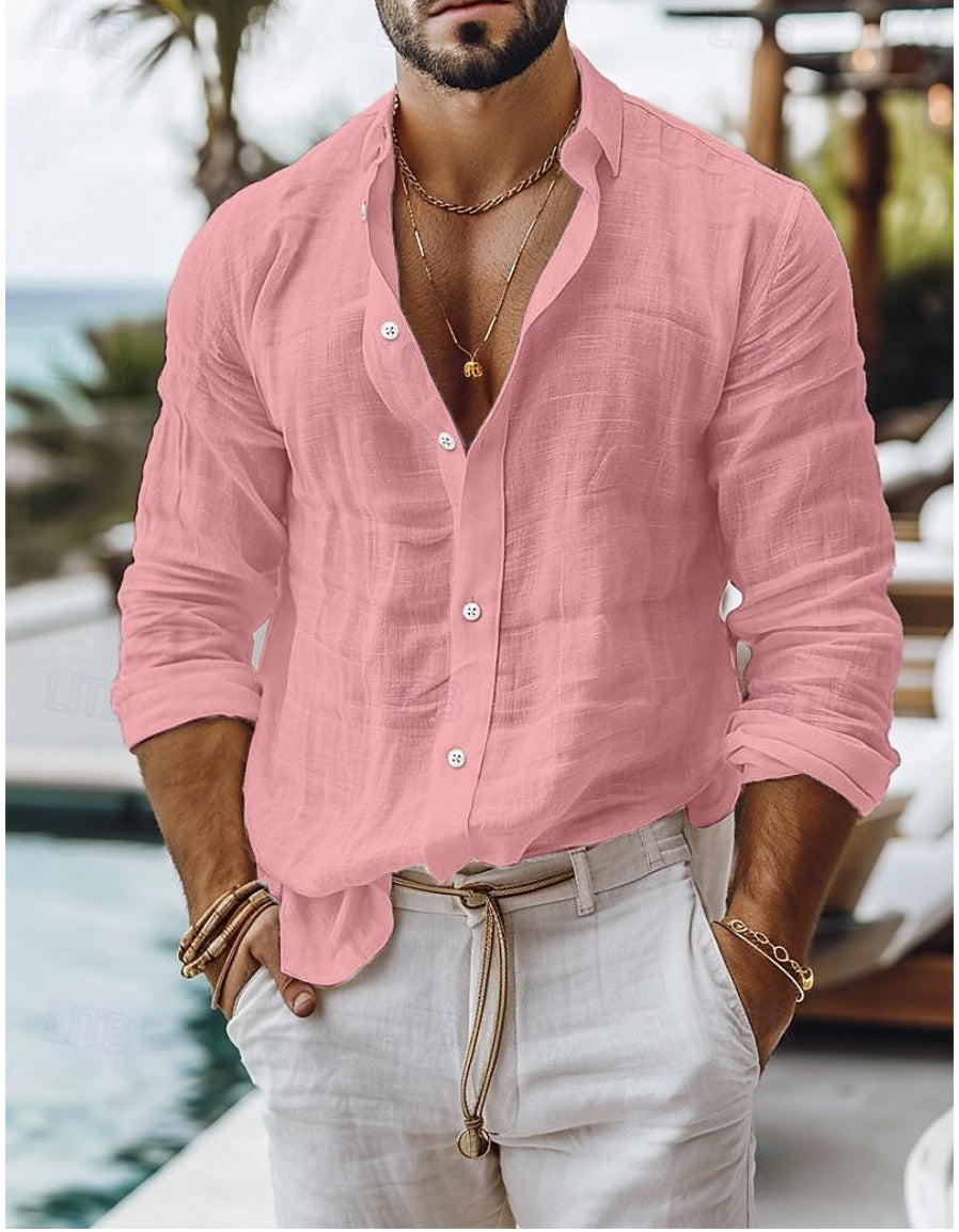 Man wearing a pink linen shirt and light pants by a poolside.