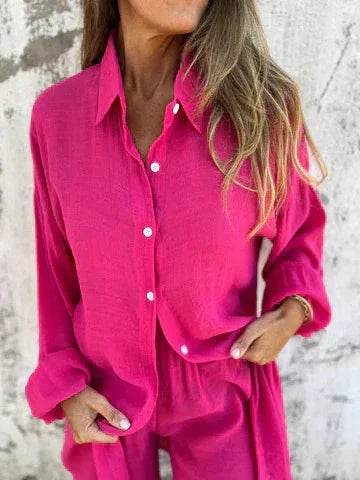 Woman wearing vibrant pink button-up shirt and pants set, ZA-Zola trendy fashion UK
