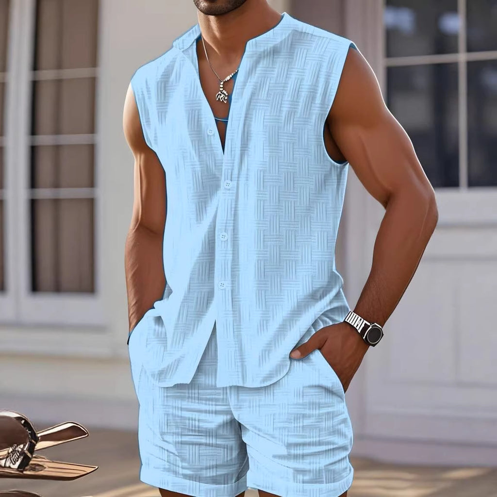 Man wearing a light blue sleeveless shirt and shorts set with a blurred background