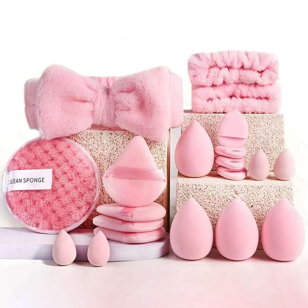 Set of pink makeup sponges, cleansing pads, and headbands for beauty and skincare