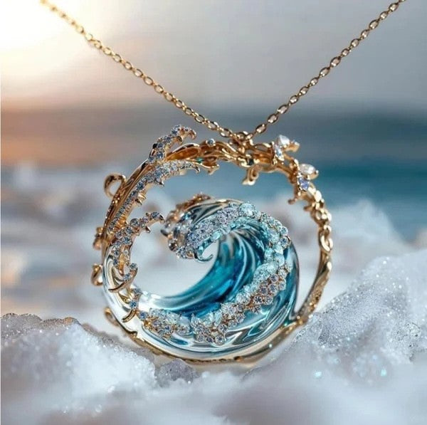 Jewelry pendant with wave design on a blurred beach background