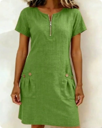 Green dress with a zipper on a white background