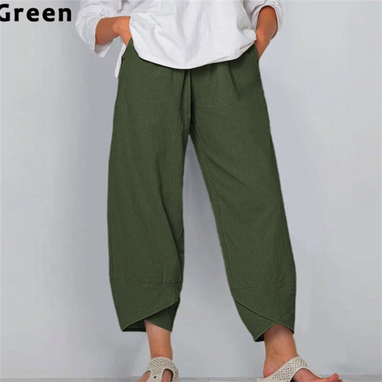 Green wide-leg pants worn by a person on a plain background