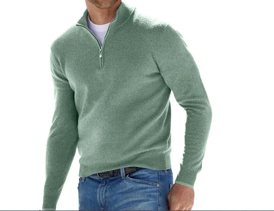 Man wearing a green long-sleeve shirt with a quarter zip on a white background