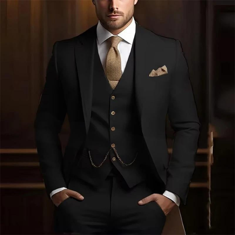 Man wearing a black suit with a white shirt, brown tie, and pocket square against a dark background.