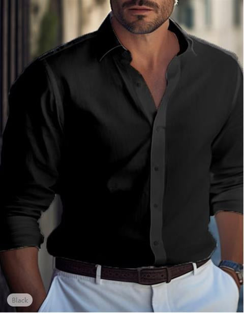 Man wearing a black button-up shirt with a blurred background