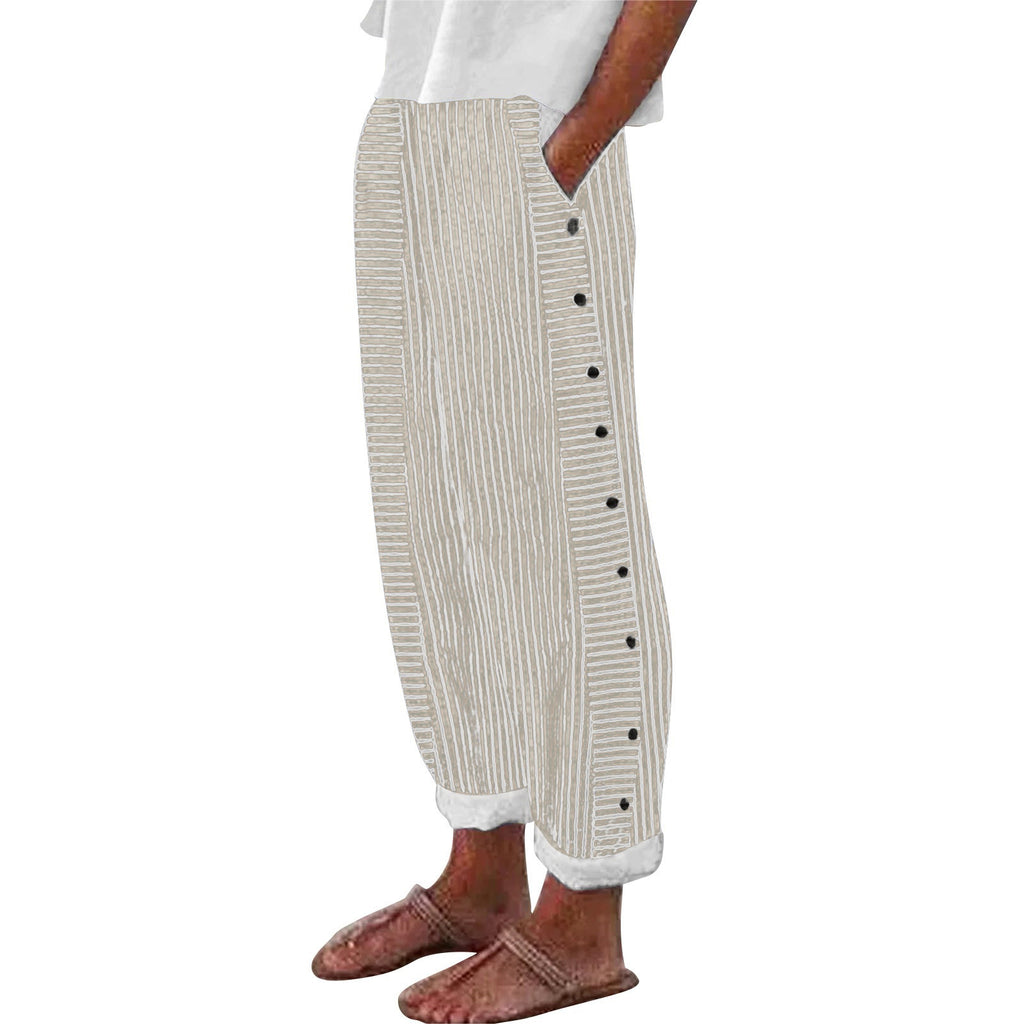Beige striped pants with buttons worn by a person on a white background