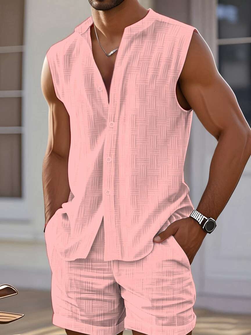 Man wearing a pink sleeveless shirt and shorts set with a blurred background