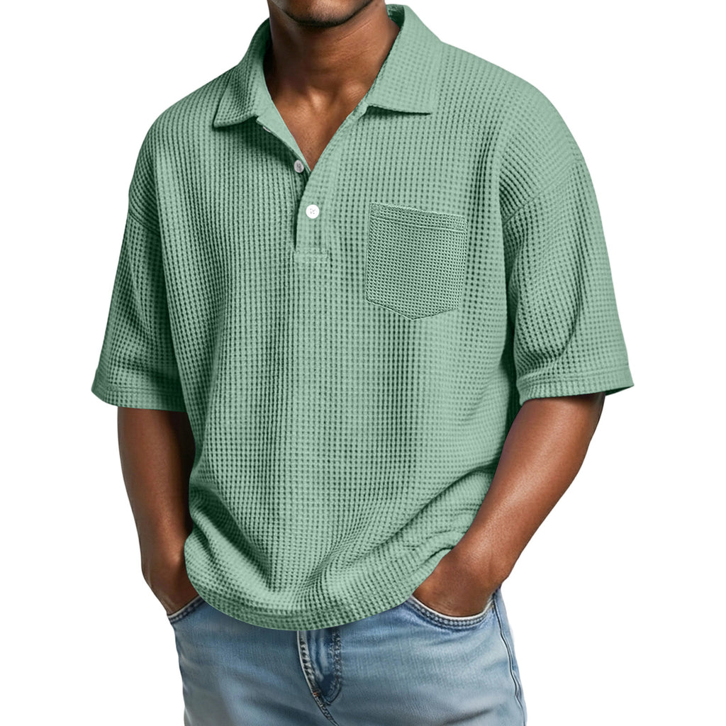 Green checkered polo shirt worn by a person on a white background