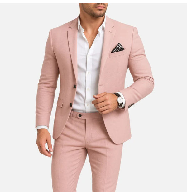 Man wearing a pink suit with a white shirt on a white background