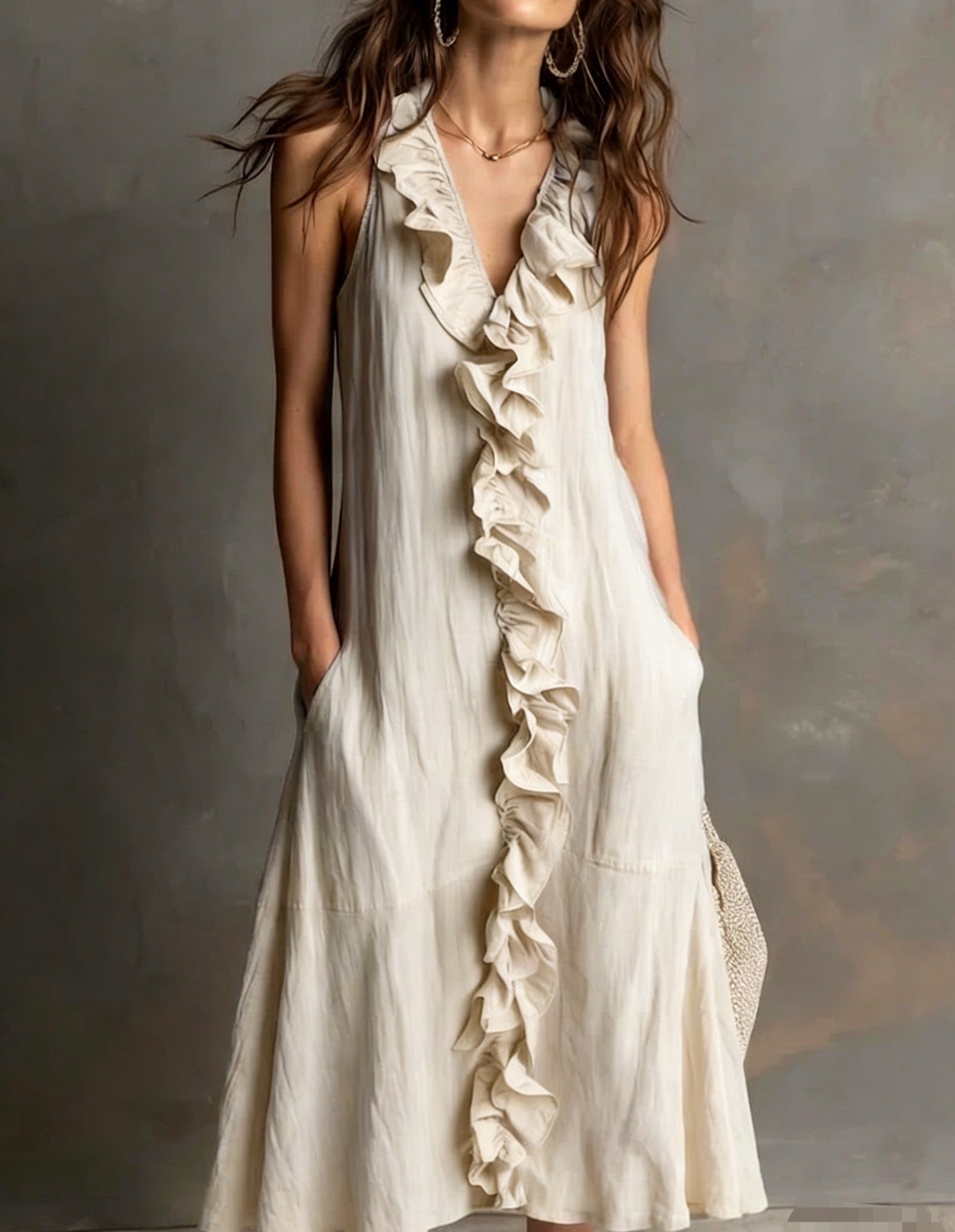 Woman wearing a white ruffled dress against a neutral background