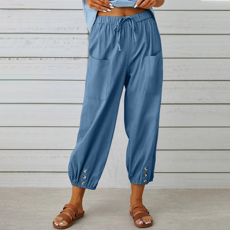 Blue pants worn by a person against a wooden background