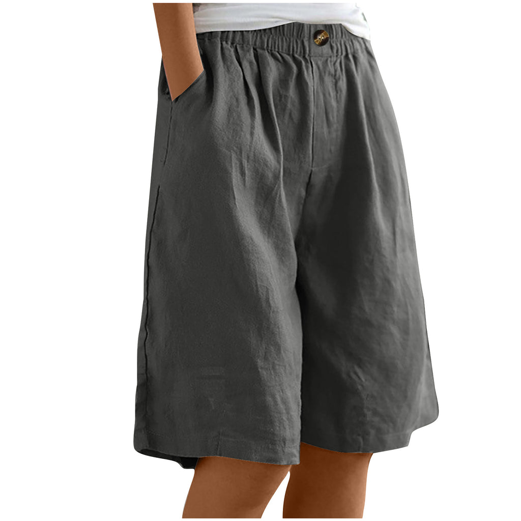 Gray shorts worn by a person on a white background