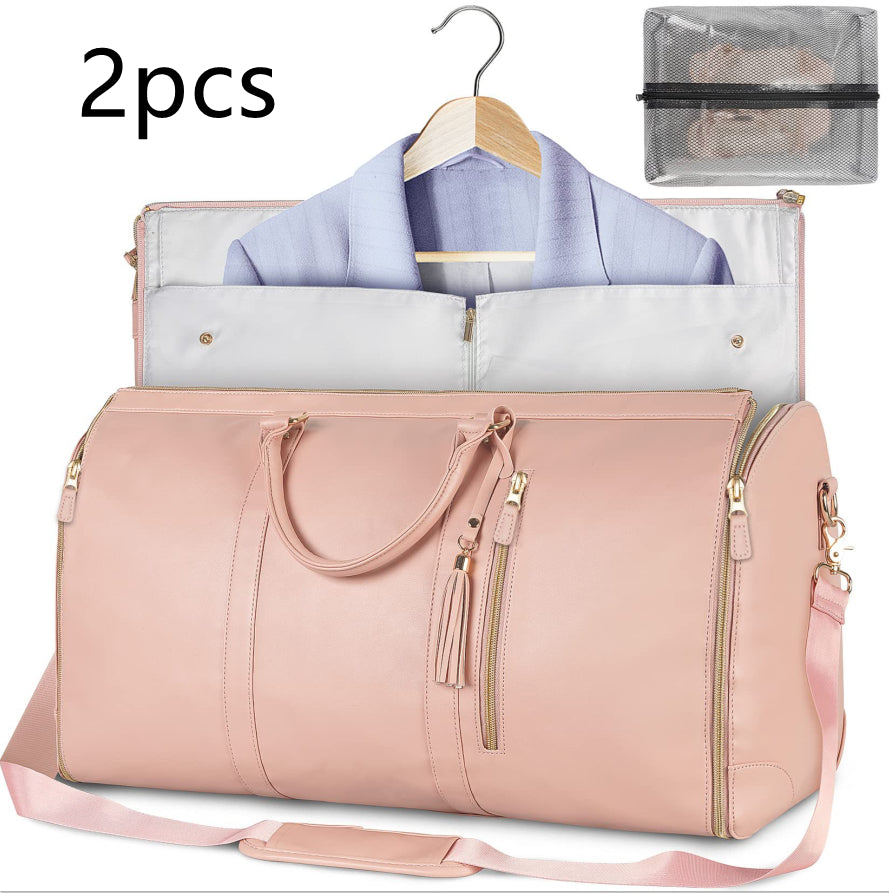 Pink duffel bag with a hanger and garment inside, on a white background.