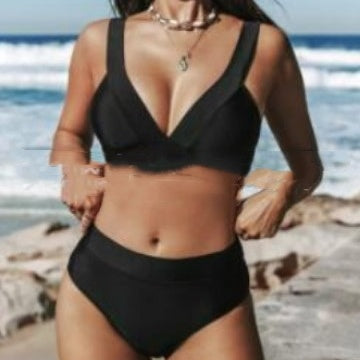 Person wearing a black bikini on a beach