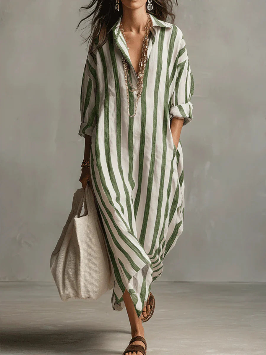 Woman wearing a green and white striped dress against a neutral background