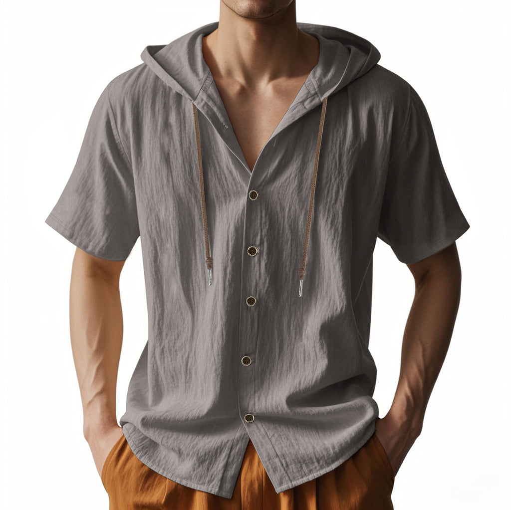 Man wearing a gray short-sleeve hooded shirt with buttons on a white background