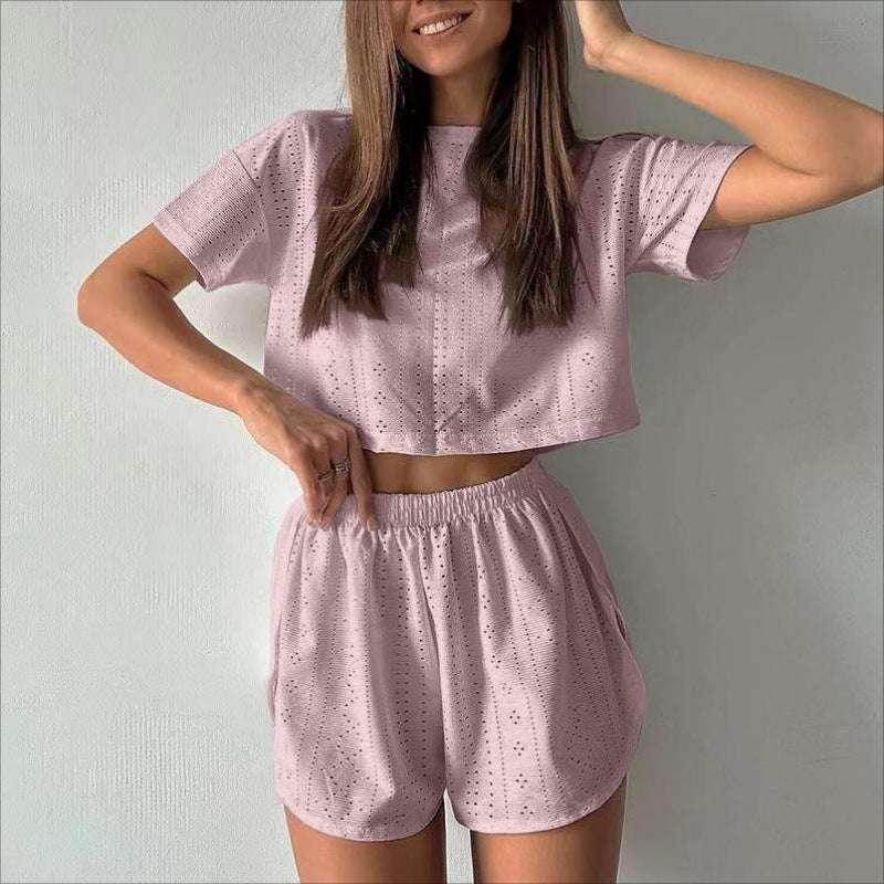 Woman wearing light pink eyelet crop top and shorts set, trendy ZA-Zola fashion