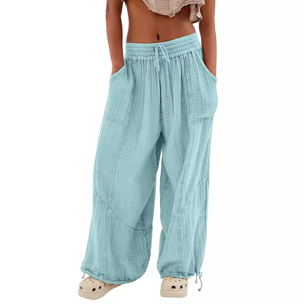Light blue checkered pants worn by a person on a white background