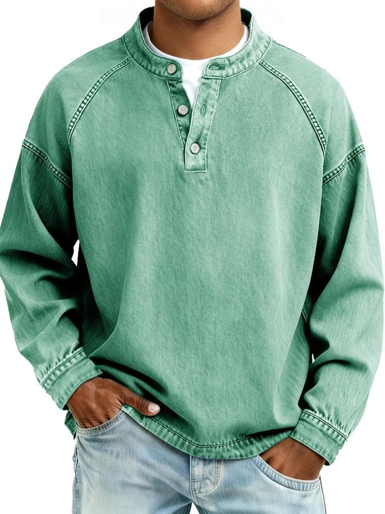 Person wearing a green long-sleeve shirt with a white collar on a white background