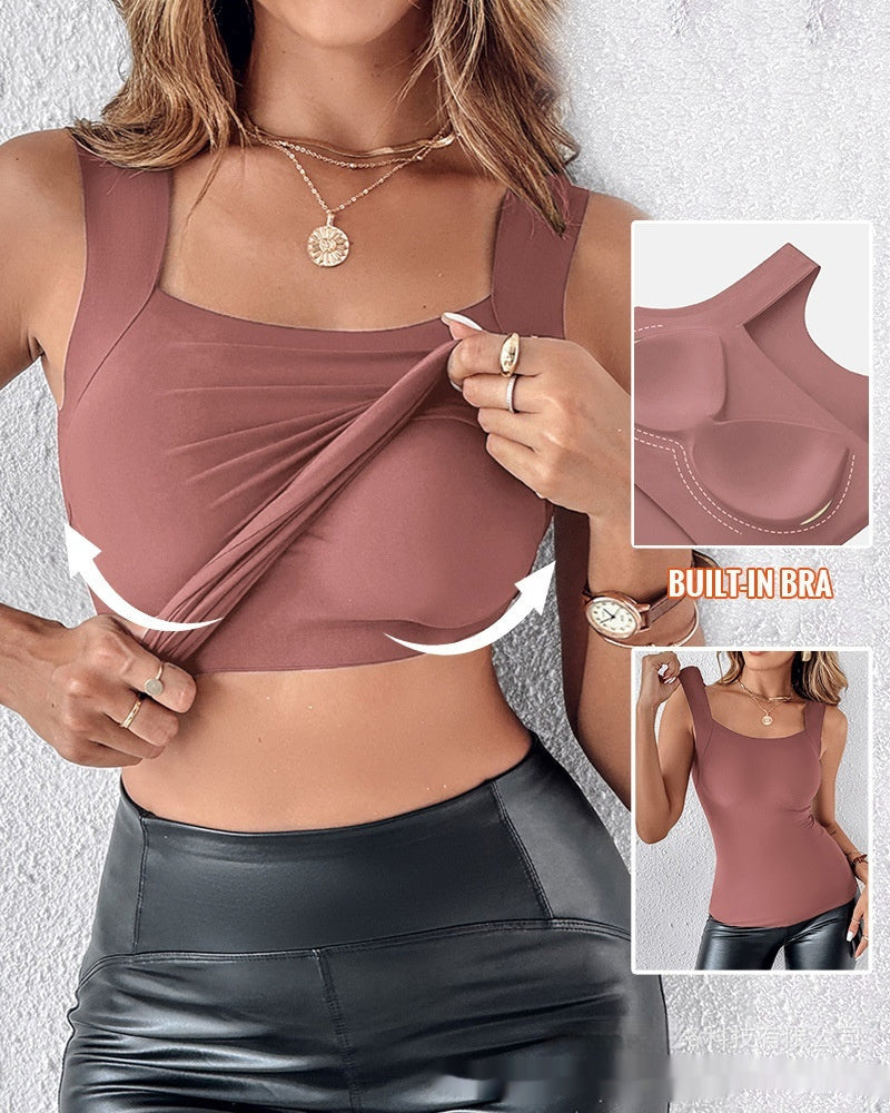 Woman wearing a mauve sports bra with built-in bra feature, showing the design and functionality.