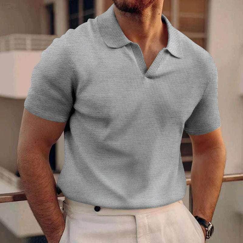 Stylish man wearing a light grey knit polo shirt and cream trousers, ZA-Zola fashion