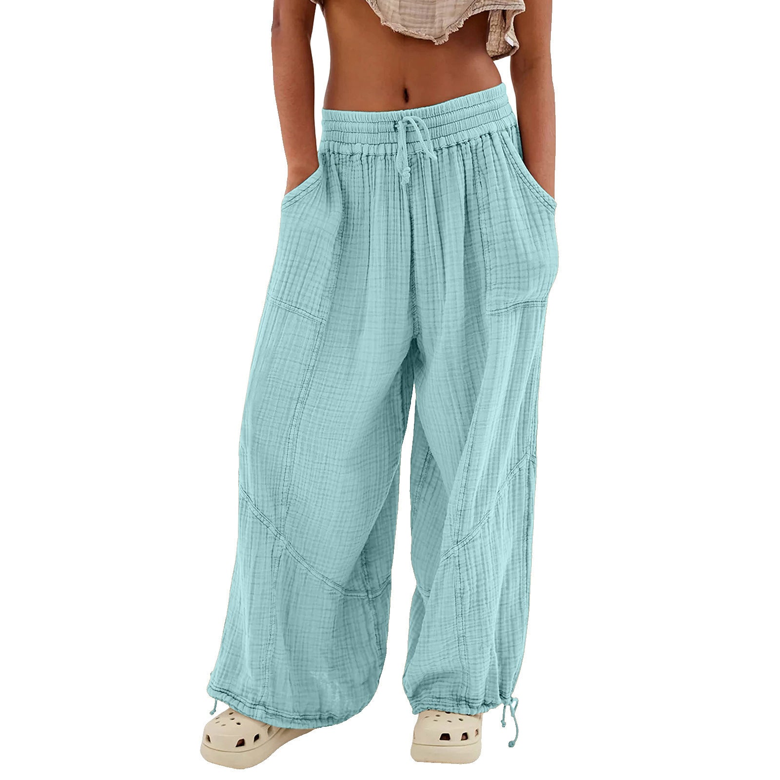 Light blue checkered pants worn by a person on a white background