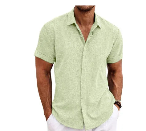 Man wearing a green short-sleeve shirt on a white background