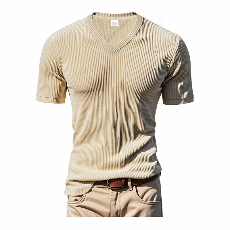 Beige ribbed t-shirt with a belt on a white background