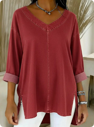 Red blouse worn by a person with a neutral background