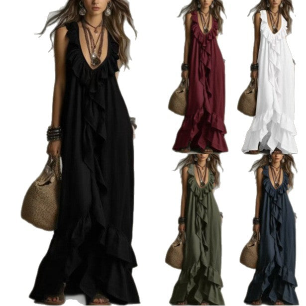 Woman wearing a black dress with ruffles and holding a beige handbag, surrounded by other dresses in different colors.