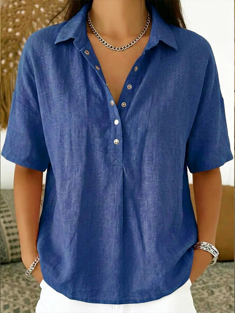 Blue shirt worn by a person with a neutral background