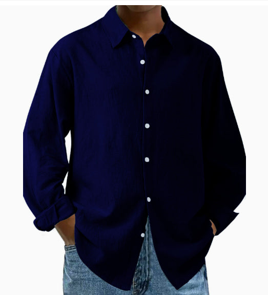 Navy blue button-up shirt worn by a person on a white background