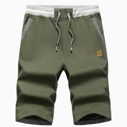 Green shorts with a white waistband on a white background