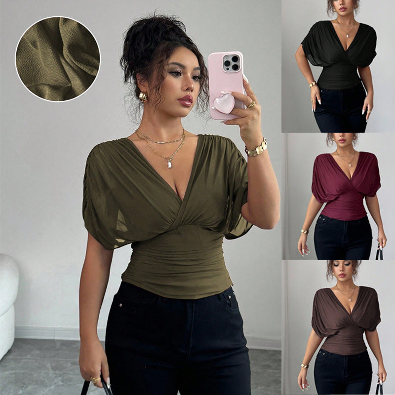 Woman taking a mirror selfie wearing a green top with puff sleeves, surrounded by images of the top in different colors.