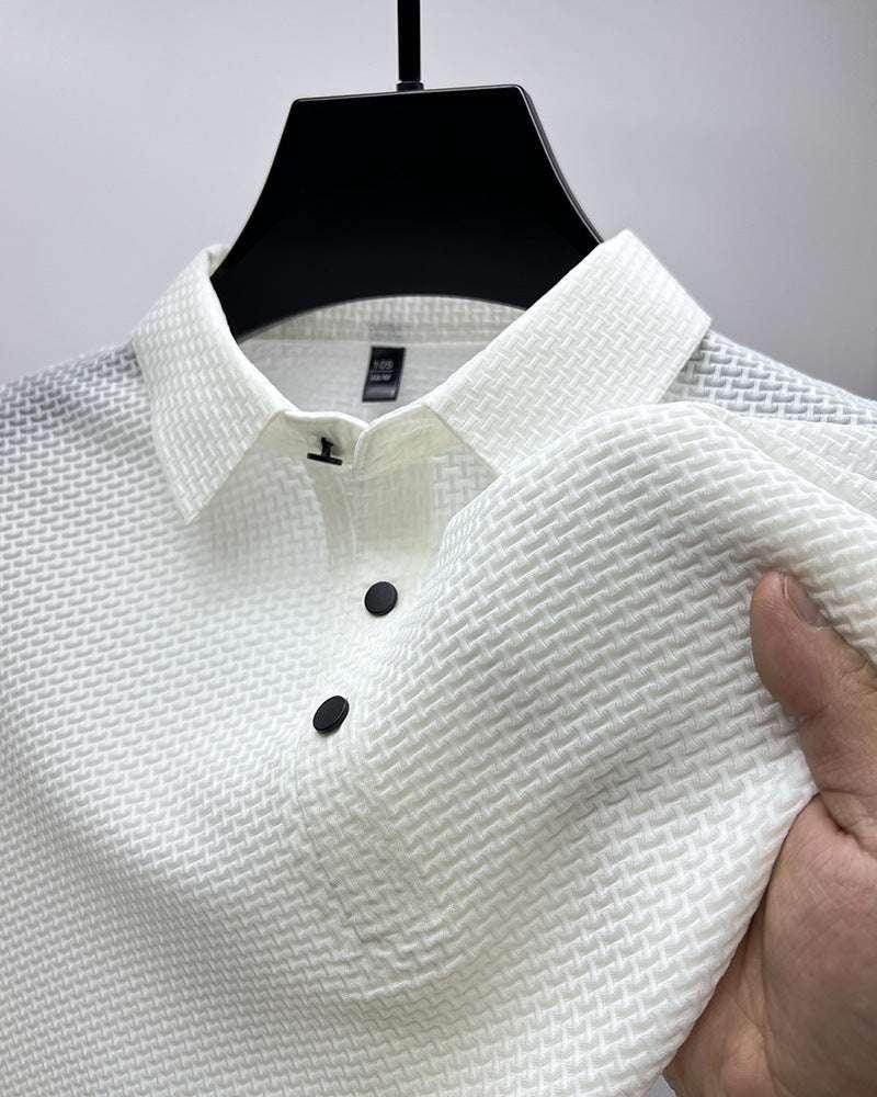 Textured white polo shirt with black buttons, showcased on hanger at ZA-Zola fashion store