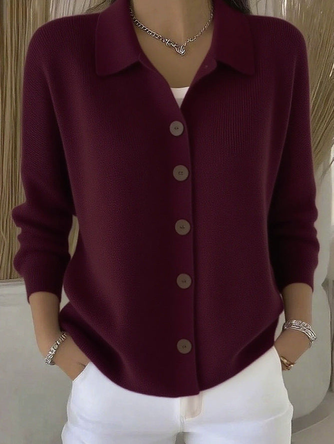 Maroon button-up shirt worn by a person with a neutral background